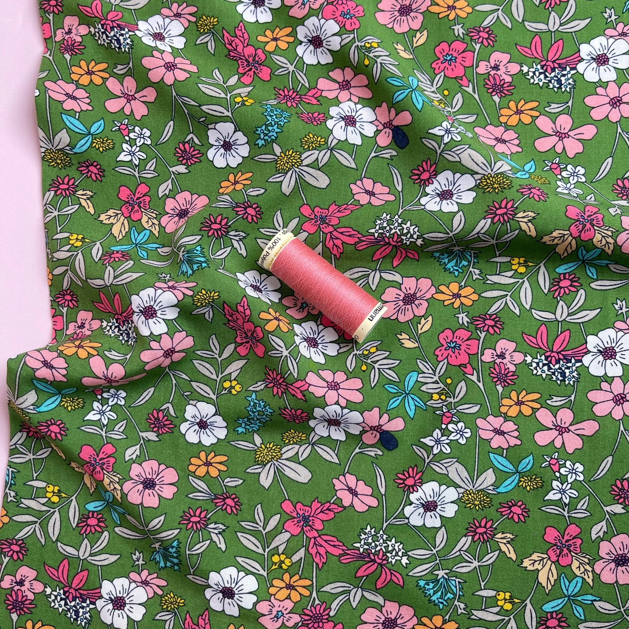 Spring Blossoms on Green Viscose Fabric